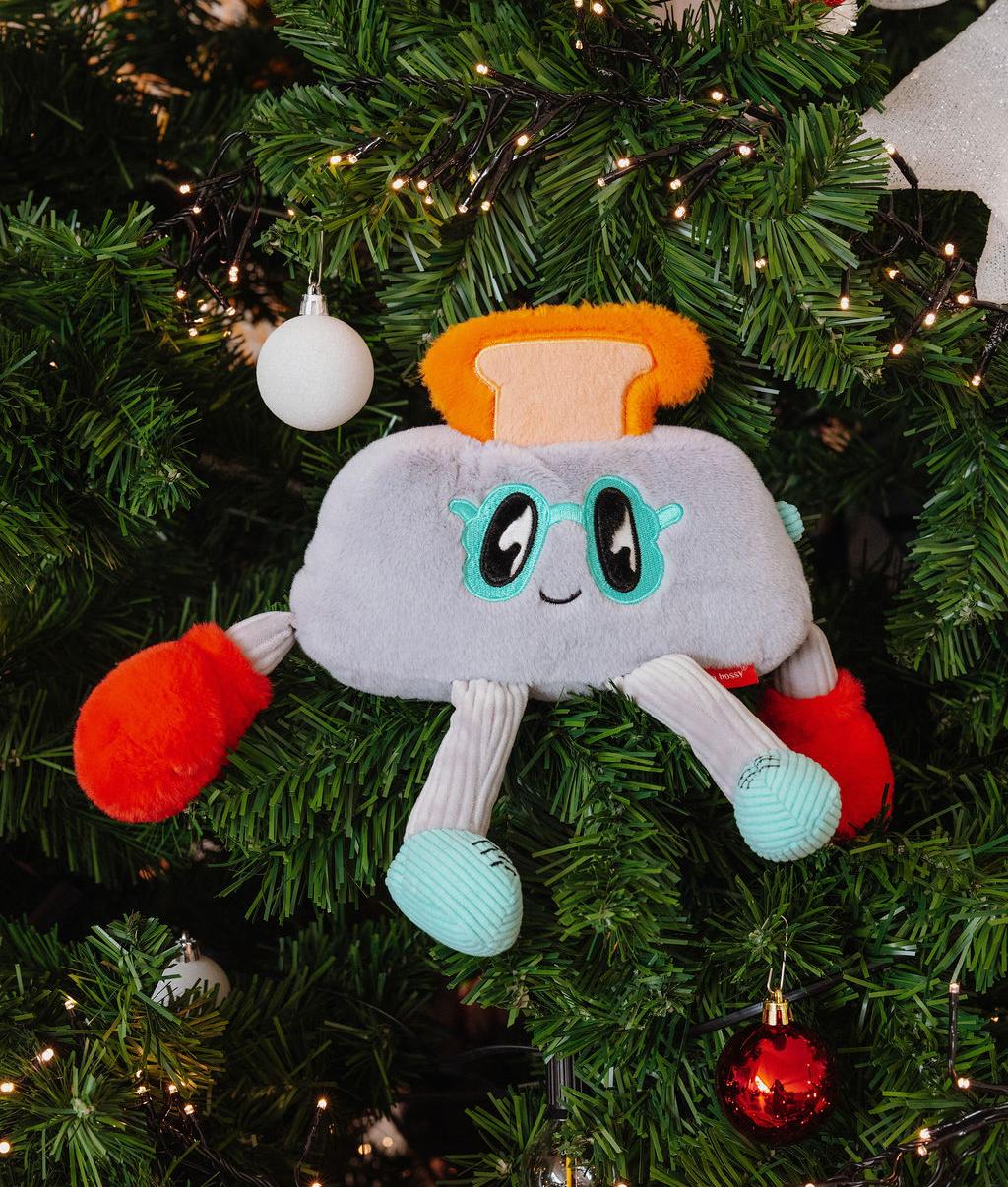 Peluche infantil cinzenta em forma de torrada com rosto e braços coloridos Hello Hossy