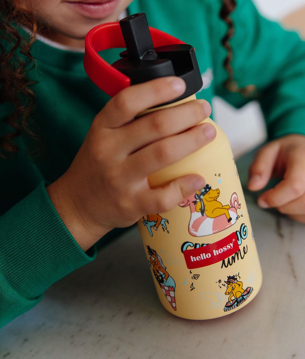 Garrafa reutilizável infantil amarela com padrão de unicórnio, pega vermelha Hello Hossy