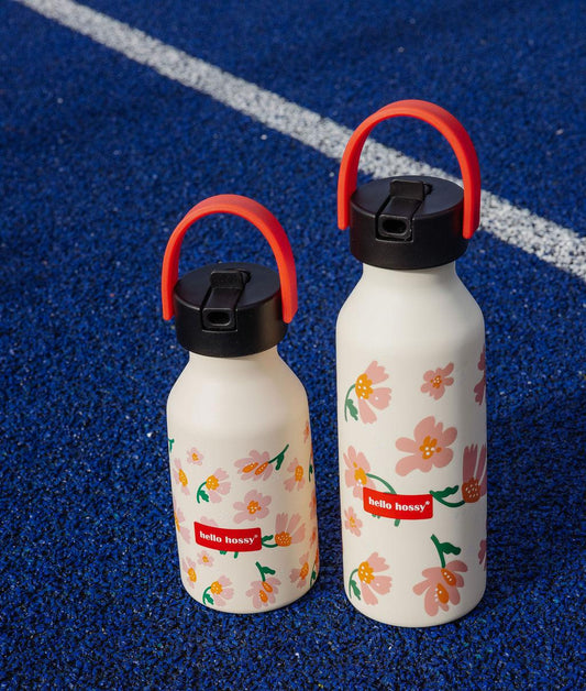Garrafa reutilizável infantil rosa, estampado de flores, pega laranja Hello Hossy