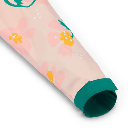 Manga de poncho infantil rosa com padrões de flores e fecho verde Hello Hossy