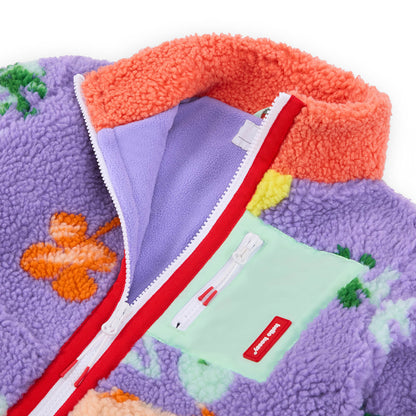 Casaco polar para criança lilás e azul com padrão de flores, gola laranja e bolso verde-claro Hello Hossy