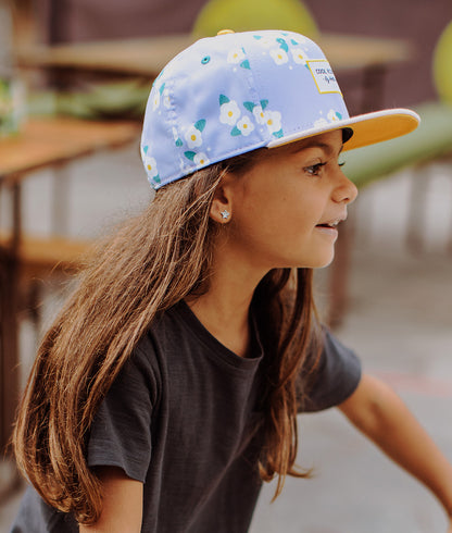 Boné infantil violeta estampado de flores com pala reta Hello Hossy